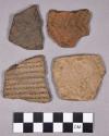 Ceramic, earthenware rim and body sherds, grit-tempered, cord- and net-impressed, incised, punctate and dentate; two perforated sherds