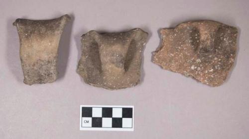 Ceramic, earthenware rim and handle sherds, undecorated, shell-tempered, one with lug, one with molded rim, shell-tempered