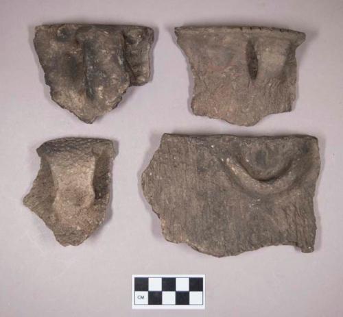 Ceramic, earthenware rim and handle sherds, some cord-impressed, one incised, one with molded rim, one with incised rim, one with molded lug, some grit-tempered, some shell-tempered