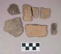 Ceramic, earthenware body sherds, some undecorated, some incised, some cord-impressed, shell-tempered; three sherds crossmend