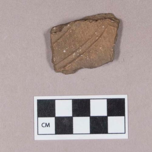 Ceramic, earthenware body sherd, cord-impressed and incised, shell-tempered