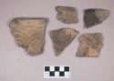 Ceramic, earthenware rim and body sherds, incised, some with possible Ramey design, one incised and punctate, one incised and cord-impressed, shell-tempered