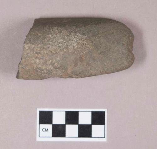 Ground stone, pecked and ground stone fragment