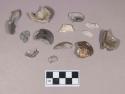 Burned bivalve shell fragments; calcined animal bone fragment