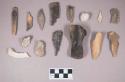 Animal bone fragments, some burned and calcined; worked animal bone fragments, burned; shell fragments, burned; impressed clay fragments