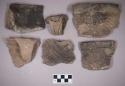 Ceramic, earthenware rim, handle, and body sherds, some incised with possible Ramie design and cord-impressed, one incised with possible Ramie design, one undecorated, one with punctate rim, some with incised rims, one with molded handle, one with punctate handle, shell-tempered