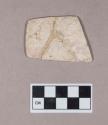 Ground stone, gorget fragment, possibly burned