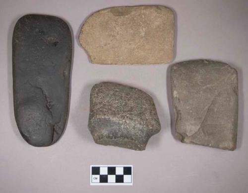 Ground stone, grooved axe fragment; ground stone, adze fragment; ground stone, flat rectangular object; worked coal, flat, rectangular