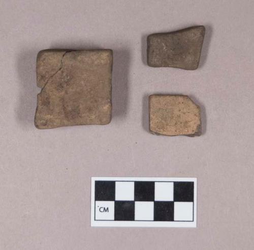 Ground stone, worked rectangular stones, with possible evidence of grinding or abrading