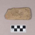 Ground stone, flat rectangular stone fragment, incised on both sides, possible bird image, one partial perforation