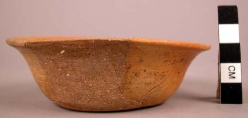 Small bowl of thin orange ware - flat bottom, flaring rim