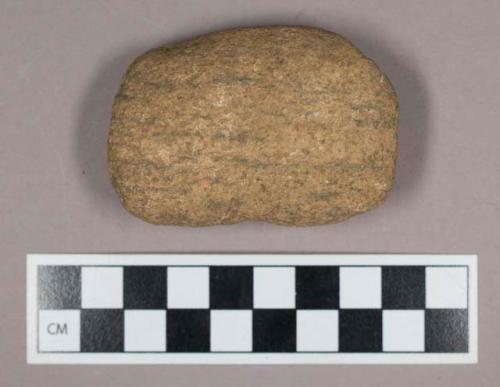 Ground stone, partially perforated atlatl weight