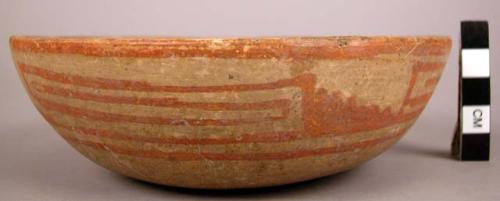 Ceramic bowl, slightly rounded base, and sides, straight rim, red on buff linear