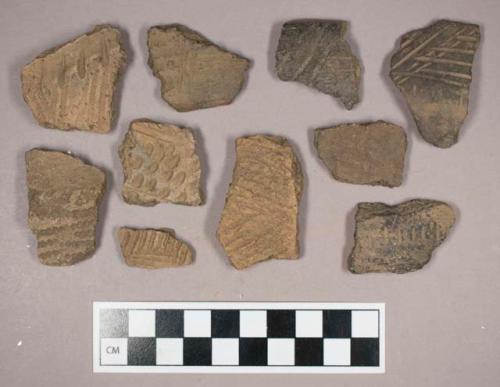 Ceramic, earthenware, body and rim sherds with punctate, incised, and impressed decoration