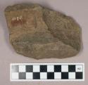 Ground stone, grooved fragment