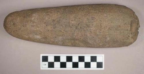 Ground stone, axe with chipped edge and notched side