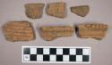Ceramic, earthenware, body and rim sherds withimpressed decoration, some sherds mend