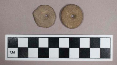 Ground stone, perforated discs