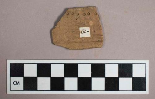 Ceramic, earthenware, rim sherd with punctate and incised decoration