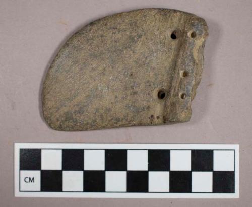 Ground stone, atlatl weight fragment with multiple perforations