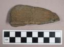 Ground stone, incised atlatl weight fragment