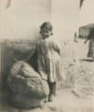 Child with stone object