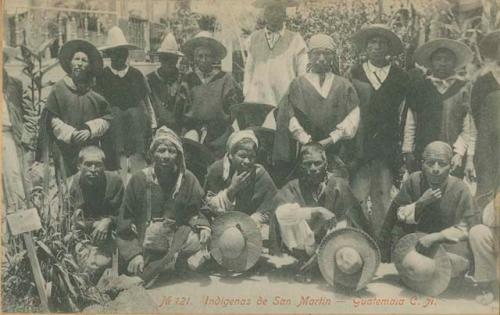 Group of men sitting and standing