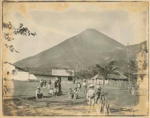 People in plaza, with volcano in background