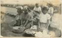 Women with baskets of food