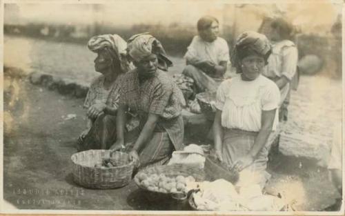 Women with baskets of food