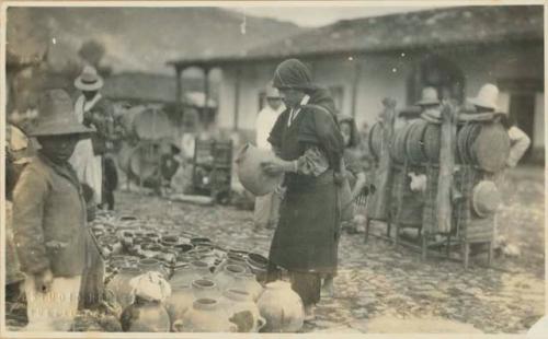 Pottery vendor at market