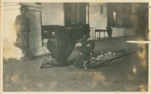 Person praying inside church