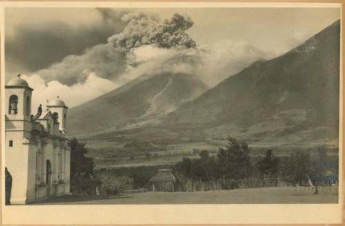 Volcán de Fuego erupting, with church in foreground