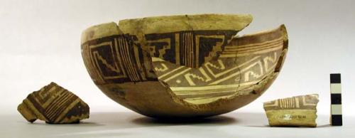 Ceramic bowl, red on cream decoration, mended, sherds missing, fire clouded