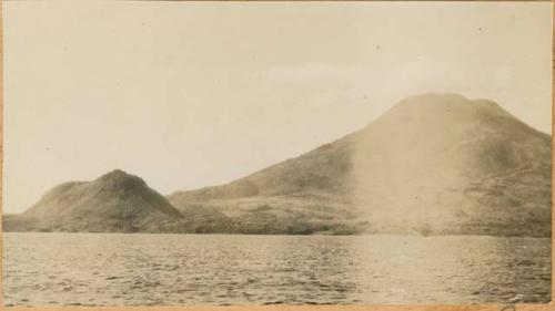 View of shoreline, with Cerro de Oro in background