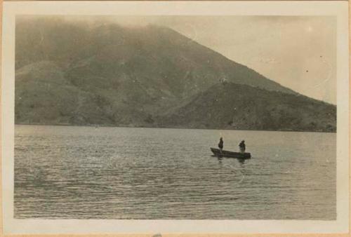 Two people in boat on lake