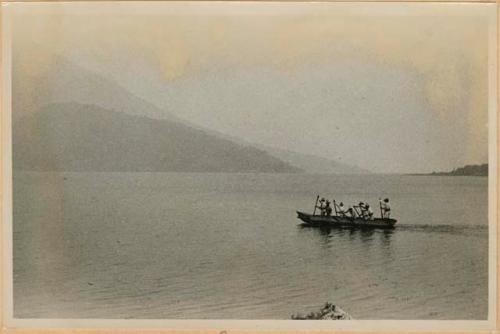 Men in boat on lake