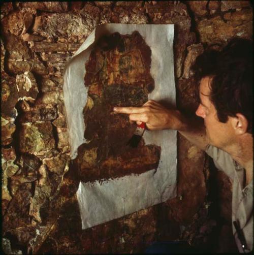 La Pasadita, Ian Graham applying mulberry paper to mural section before removal