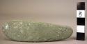 Ground stone polishing stone, ovate, green, curved, smooth