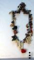 Woman's necklace of china and glass colored beads, beetle head, 2 fish+
