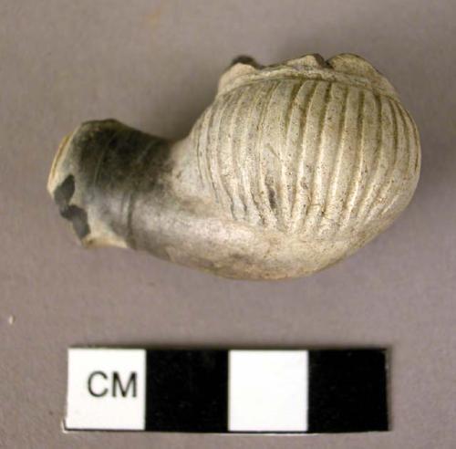 Broken bowl of clay pipe, incised design