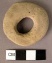 Perforated pottery disk