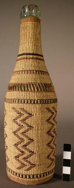 Basketry covered glass bottle with cover