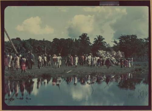 Ngobe-Bugle site at mouth of the Cricamola River, view of large crowd, man with ladder in left frame