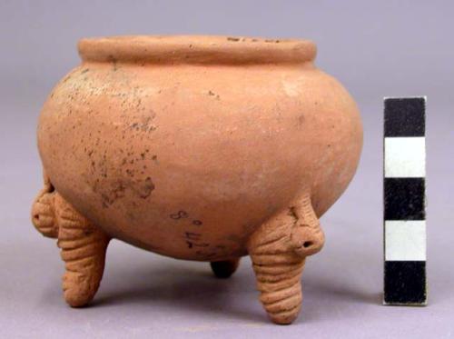 Pottery dish, tripod, legs solid and carved