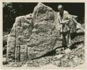 Giles Greville Healey standing before Stela 1 fragment at Bonampak