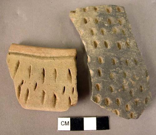 2 potsherds-pitted decoration