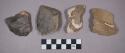 Flint scrapers, unifacial points, flakes, and a brick fragment