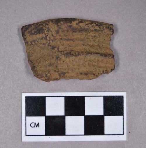 Ceramic, earthenware rim sherd, dentate-decorated, grit-tempered