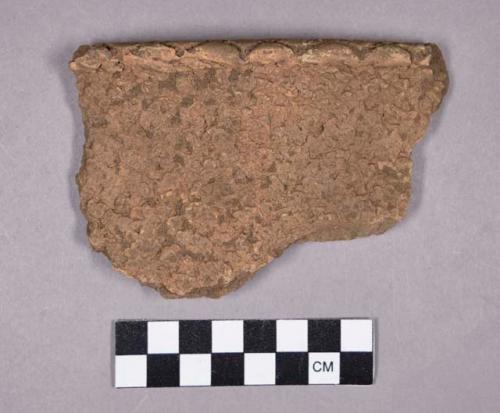 Ceramic, earthenware rim sherd, net-impressed body, dentate rim